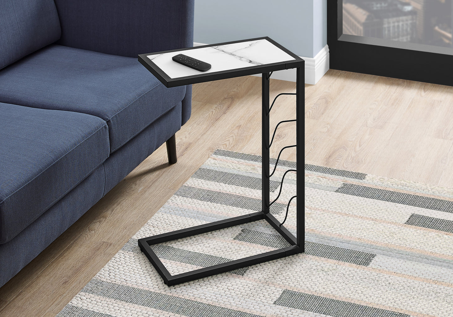 Black metal Ctable with faux marble top and remote perfect for living room snacks