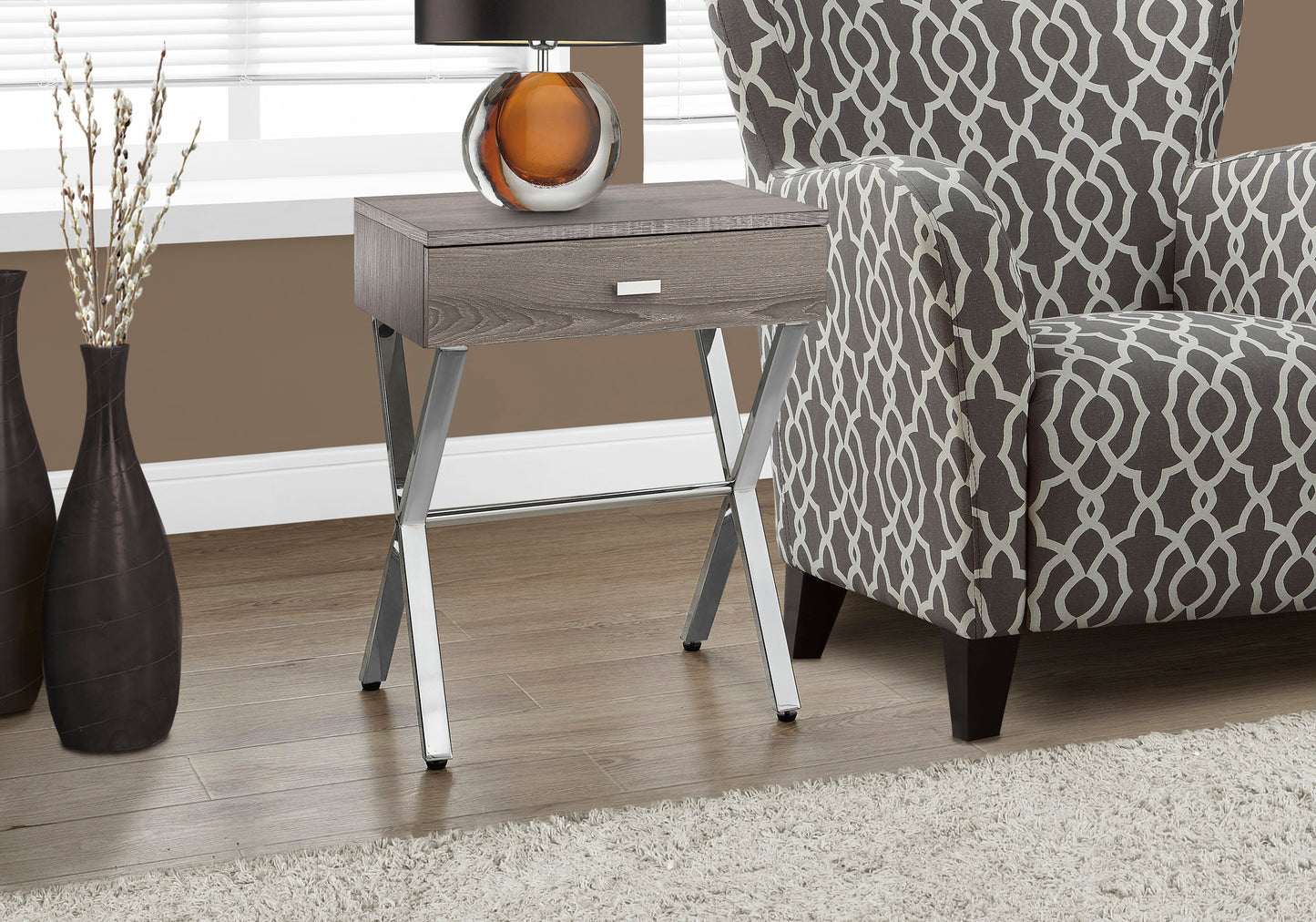 Gray wood grain end table with a chrome frame and single drawer perfect for living rooms