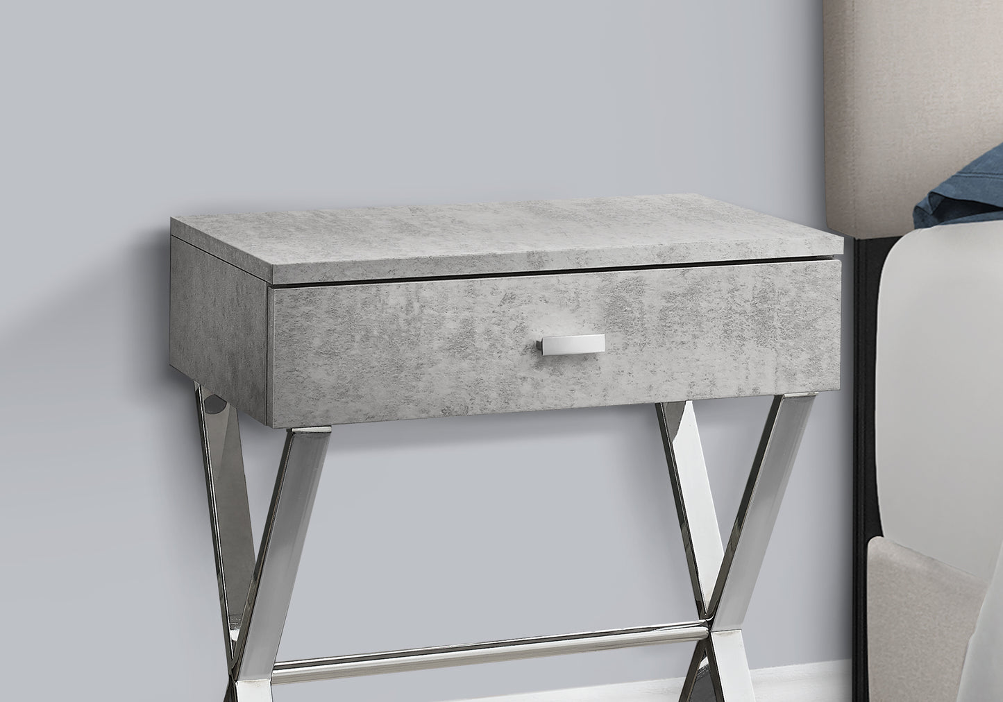 Modern gray concrete bedside table with silver legs and one drawer
