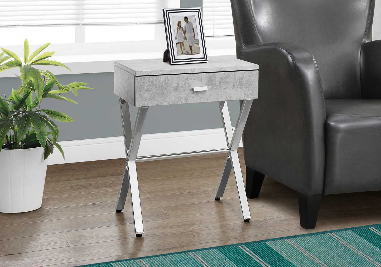 Gray concretelook end table with silver Xframe legs and one drawer