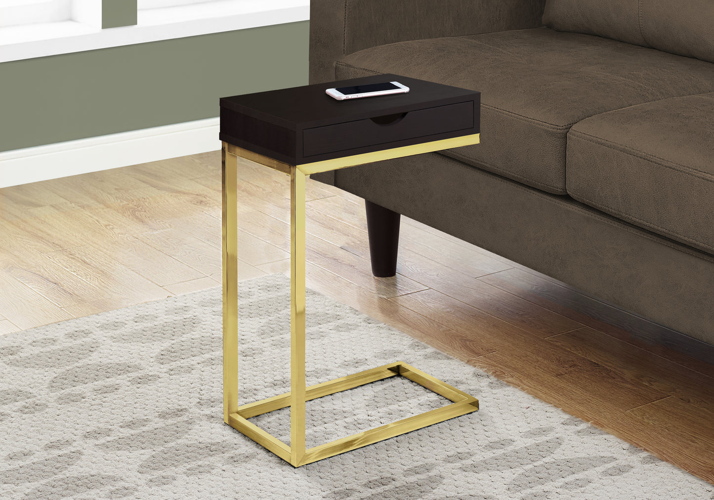 Dark brown ctable with gold metal frame and single drawer phone on top