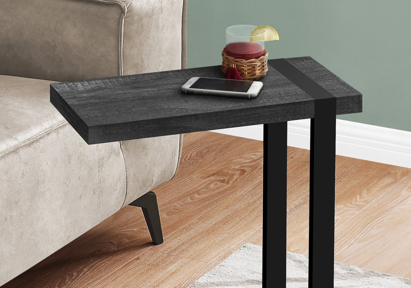 Dark wood Ctable with phone and drink fits beside couch