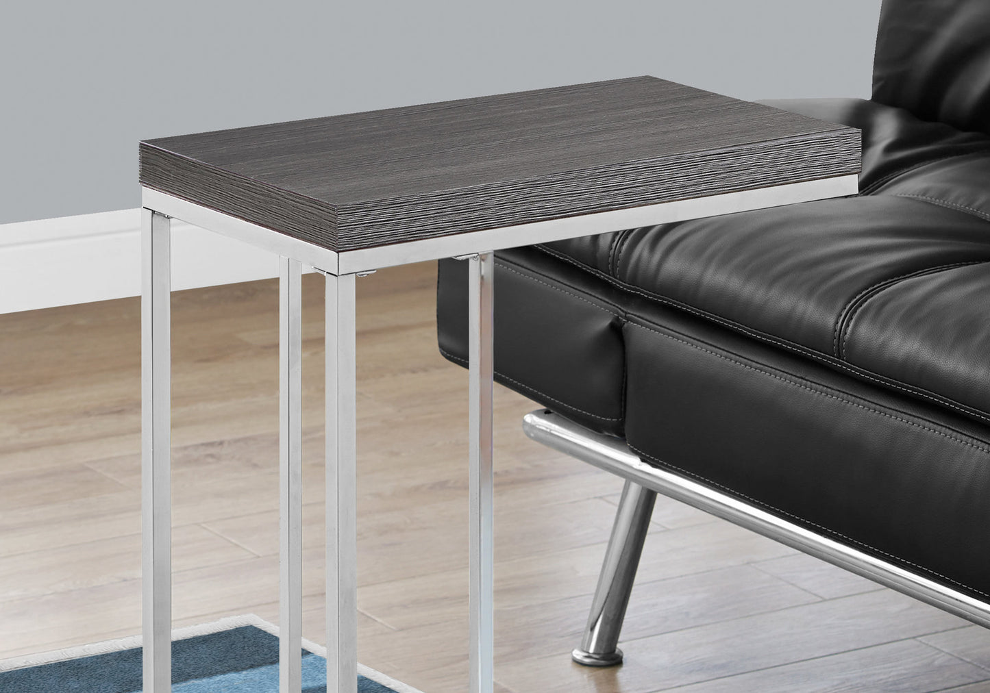 Dark wood grain accent table with chrome legs perfect for small living spaces