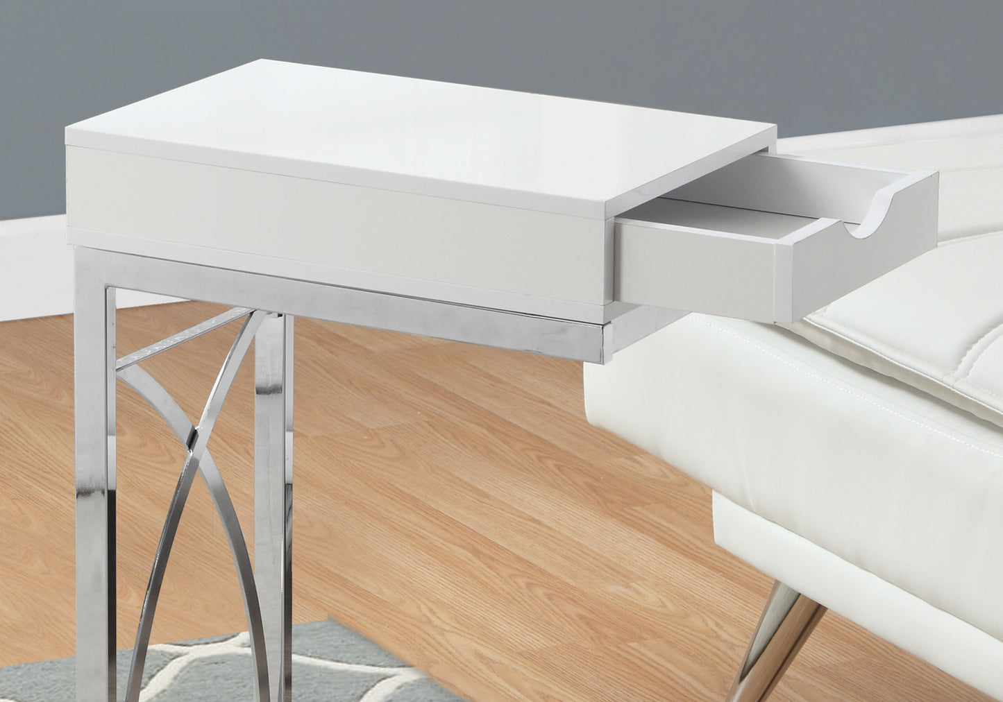 White high gloss ctable with open drawer and chrome legs
