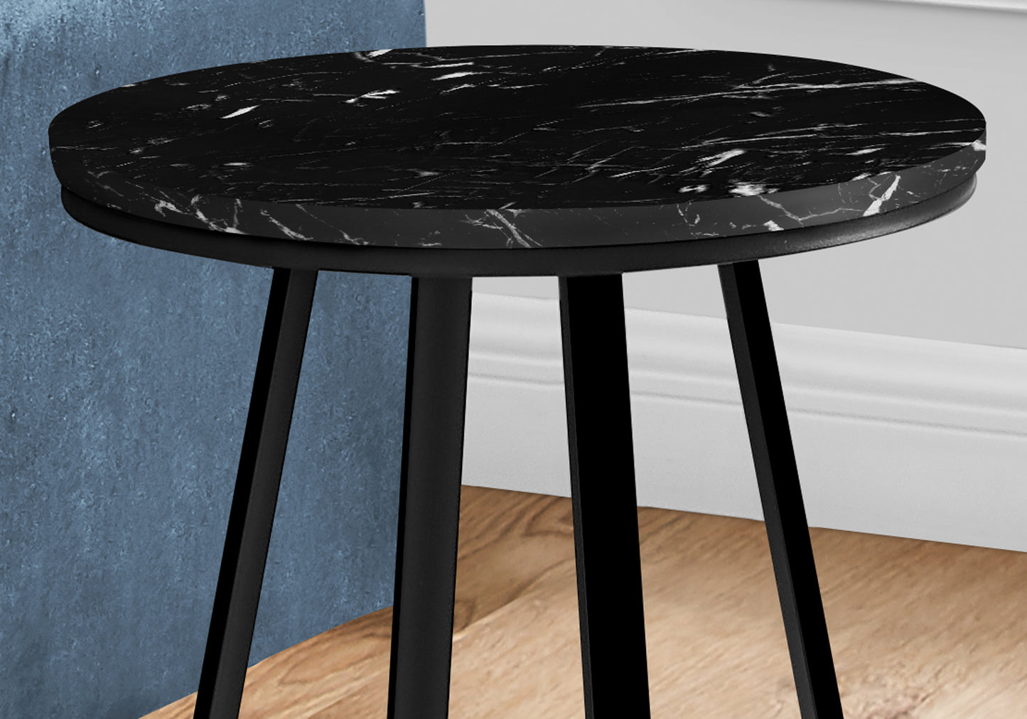 Round black marble side table with black metal legs