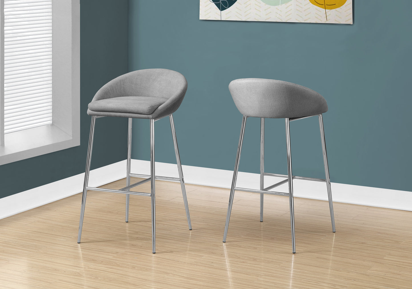 Gray upholstered bar stools with sleek chrome legs