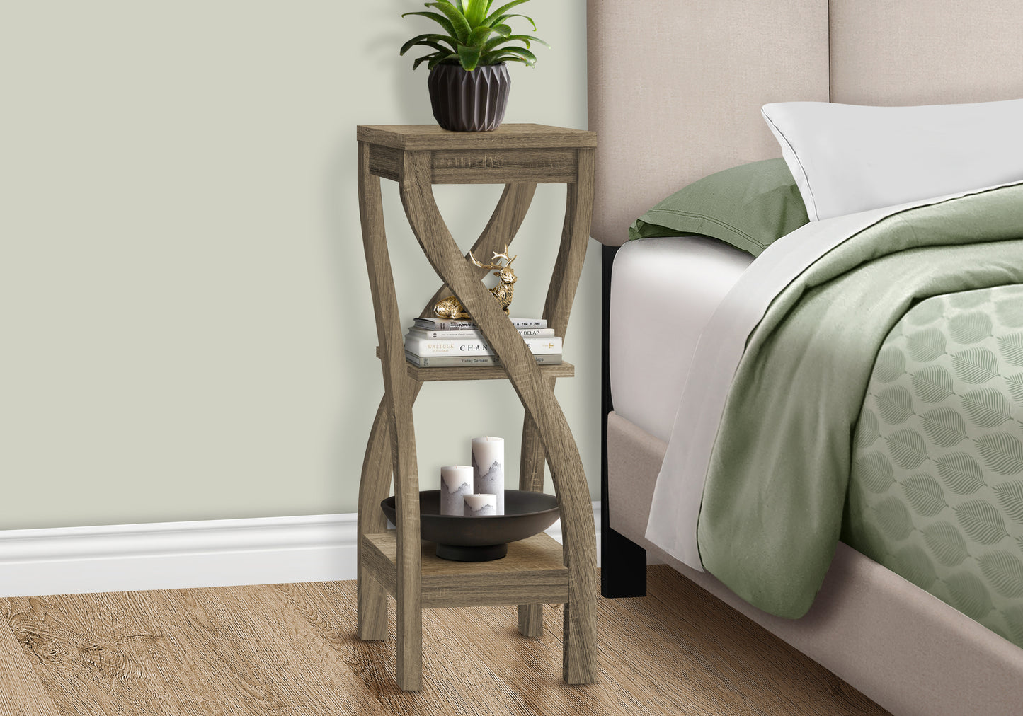 Rustic brown wood accent table with crisscross legs and decorative items