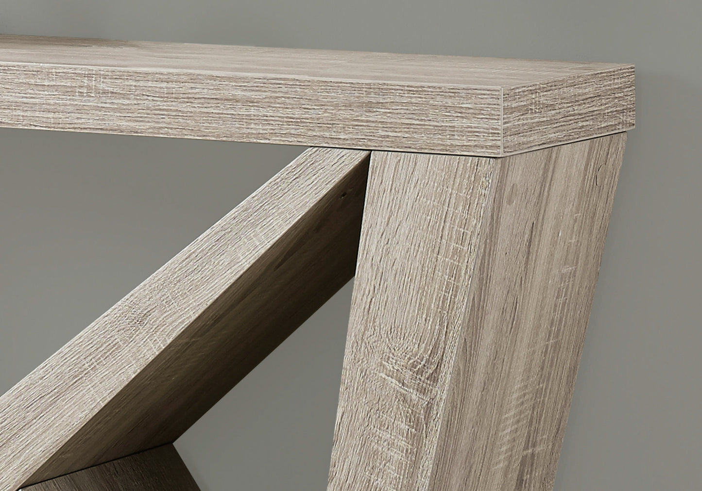 Closeup of rustic oak wood grain texture on a modern console table leg