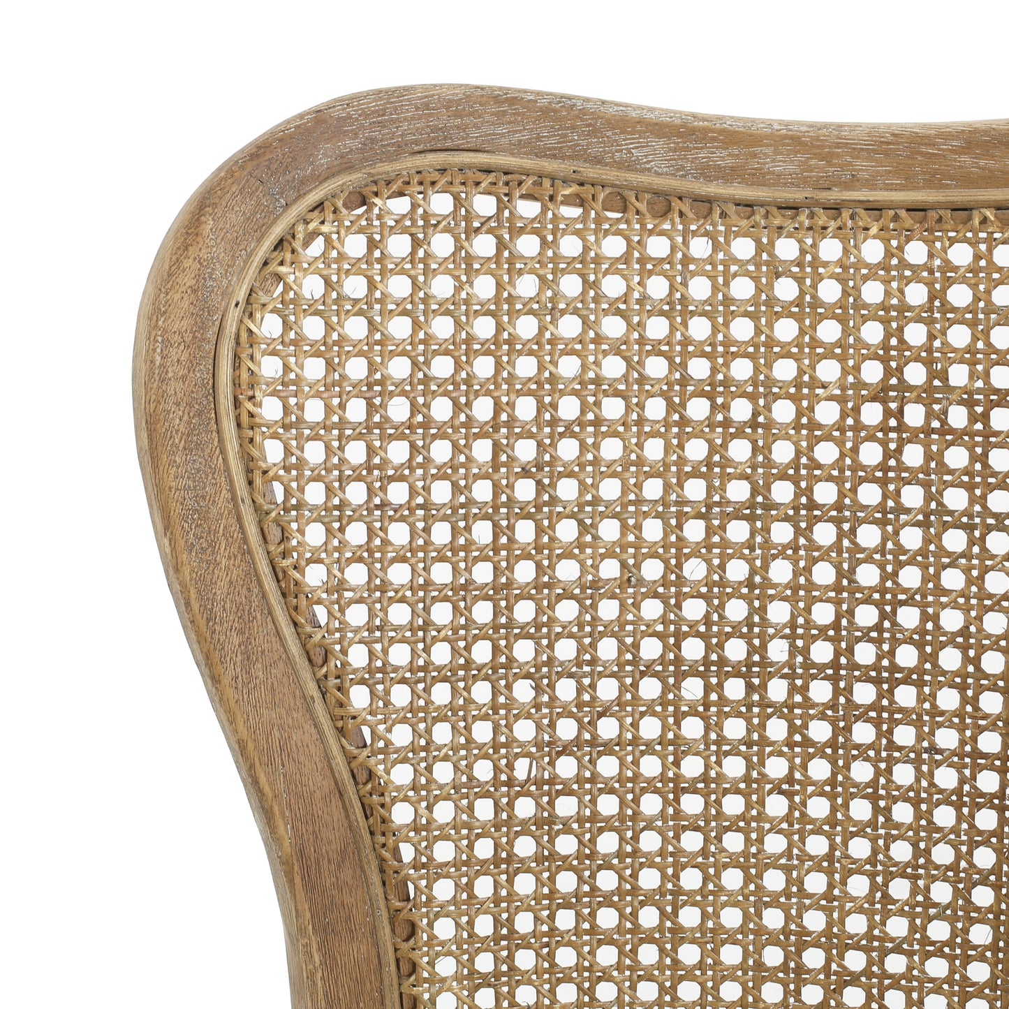 Closeup of a distressed wood frame with intricate cane webbing on a chair back