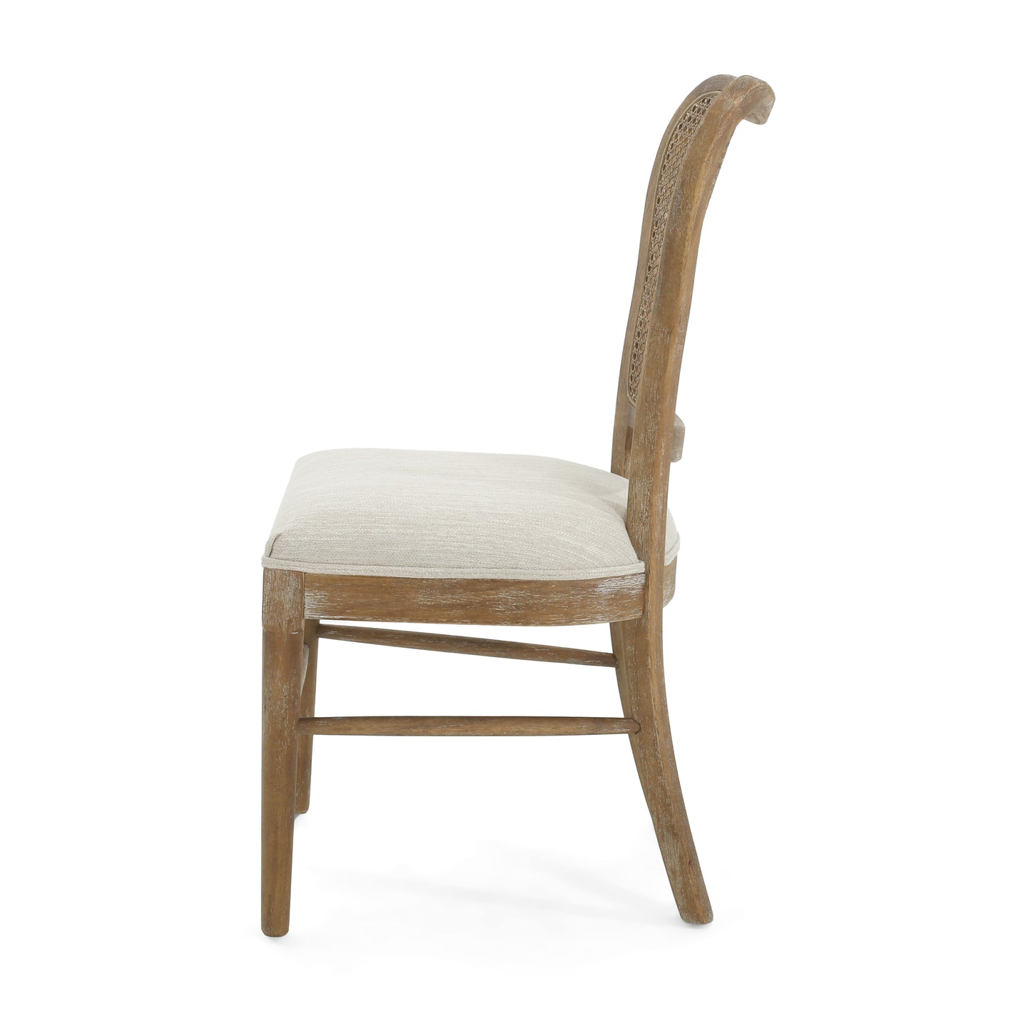 Side view of a light wood dining chair with a woven cane back and a neutral fabric seat