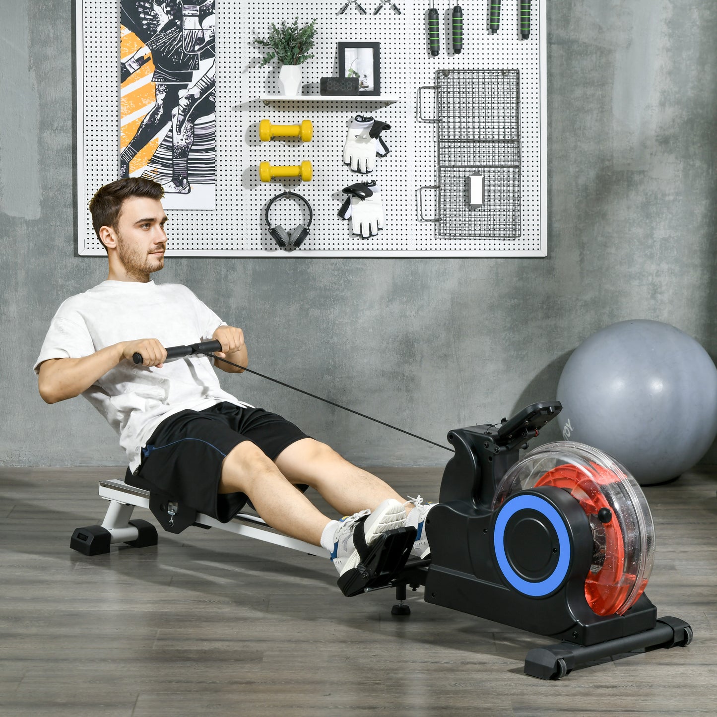 Man using a black and red water rower for cardio workout