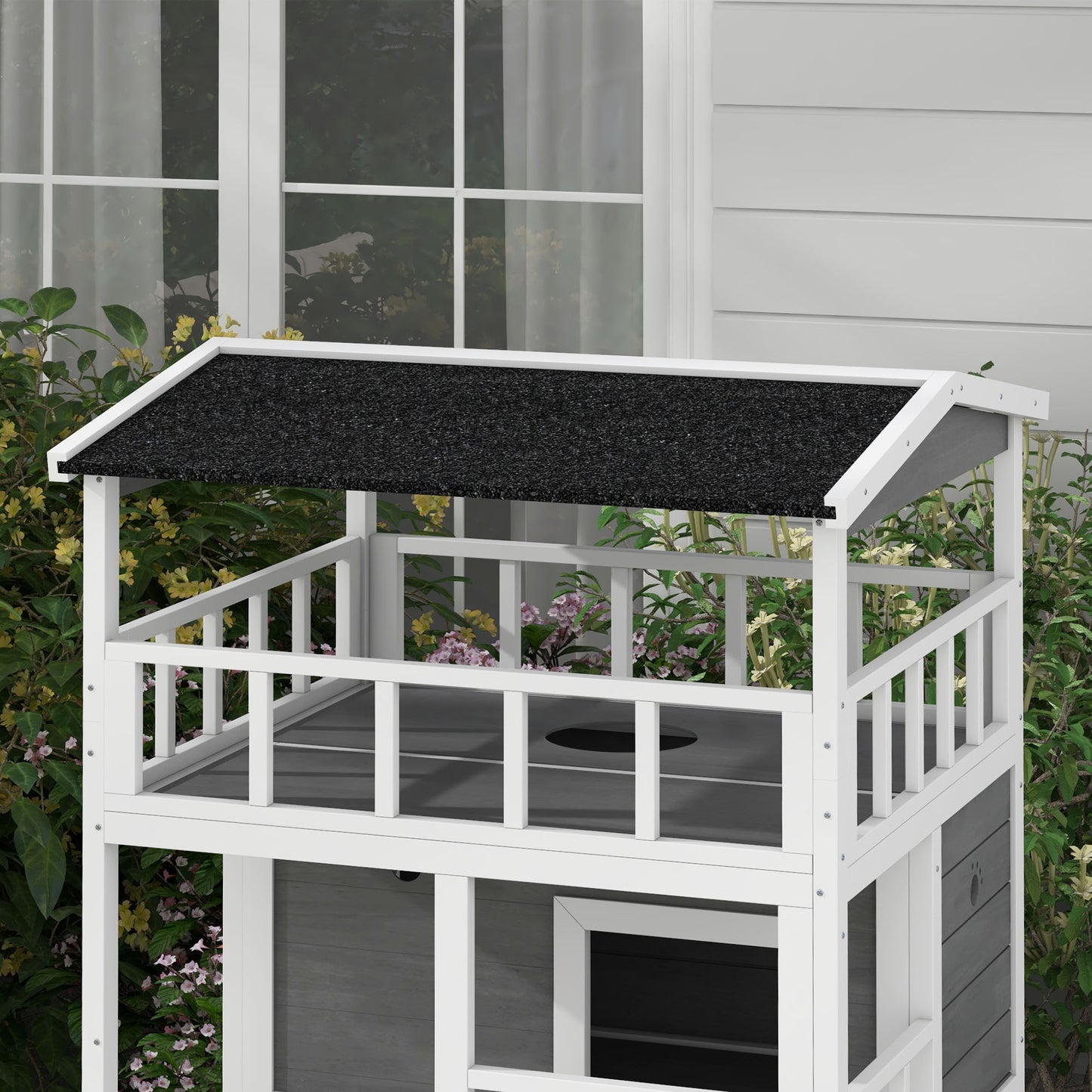 Twotier white and grey wooden cat condo with black asphalt roof and railing