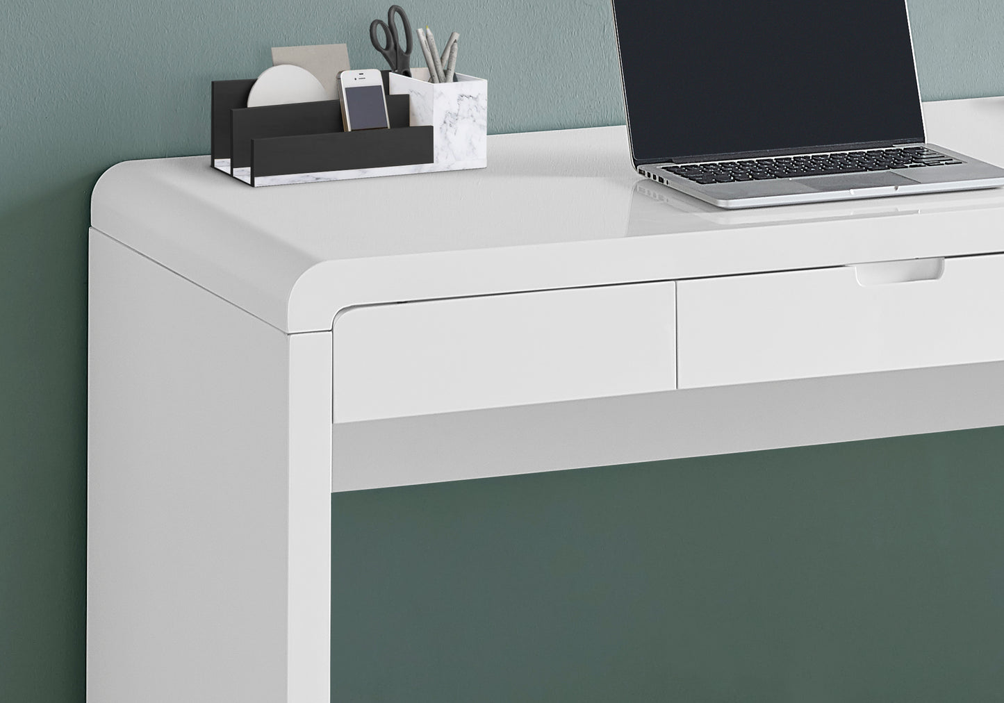 Modern white desk with sleek drawer and integrated laptop perfect for home office