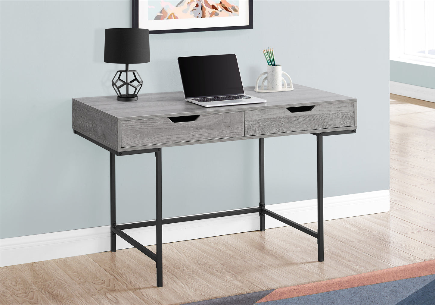 Rustic grey wood desk with two drawers and sleek black metal legs perfect for home office