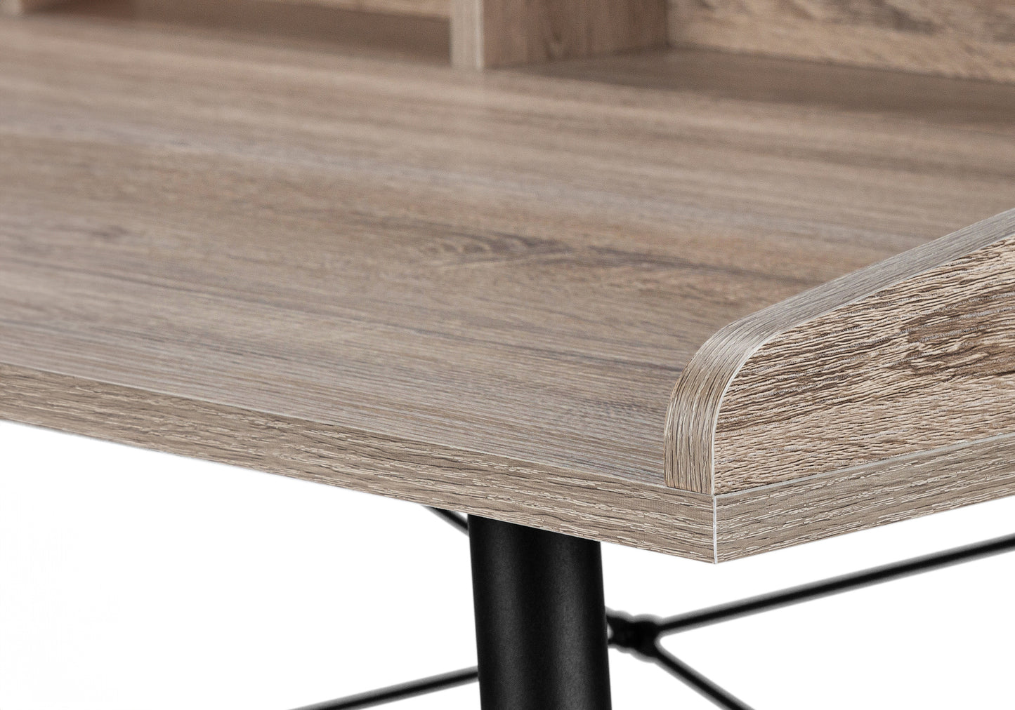 Closeup of a rustic oak finish wooden desk surface with a rounded edge