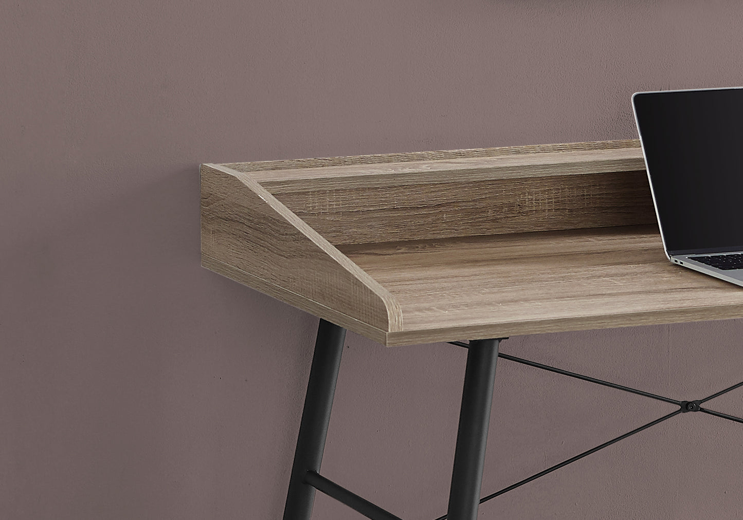 Wooden desk with raised monitor stand and black metal legs