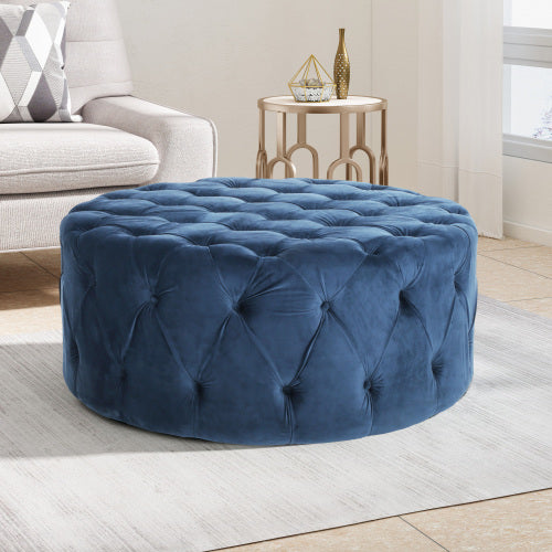Deep blue velvet tufted round ottoman