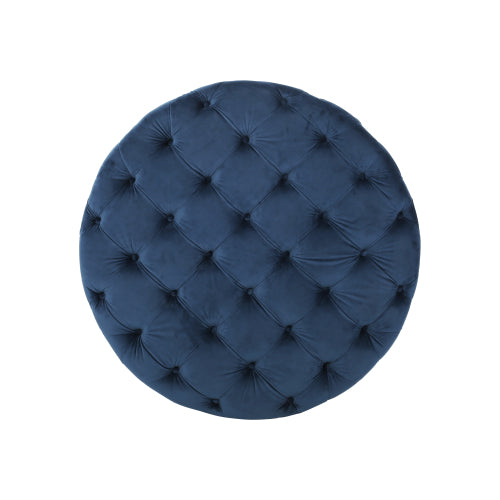 Deep blue velvet round ottoman with diamond tufting perfect for accent seating
