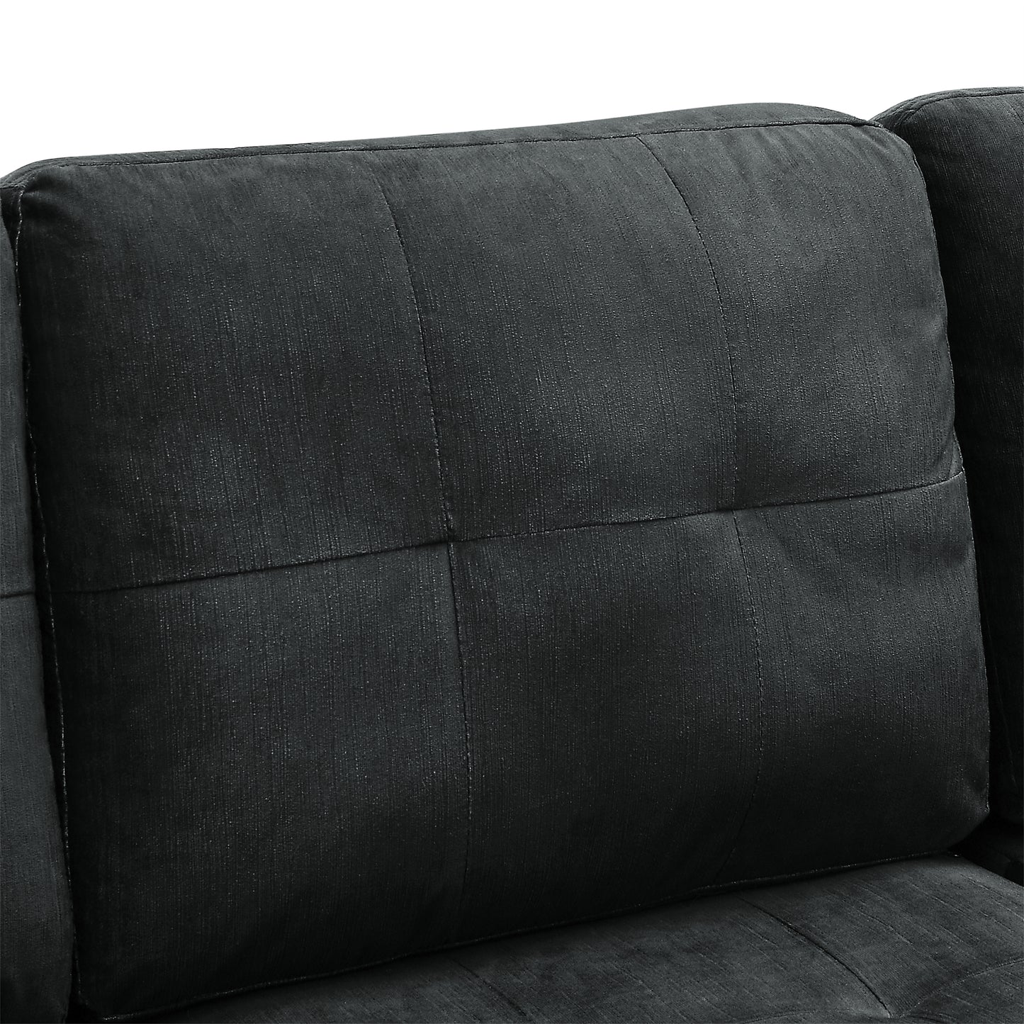 Closeup of a plush charcoal grey sofa cushion with quilted detail