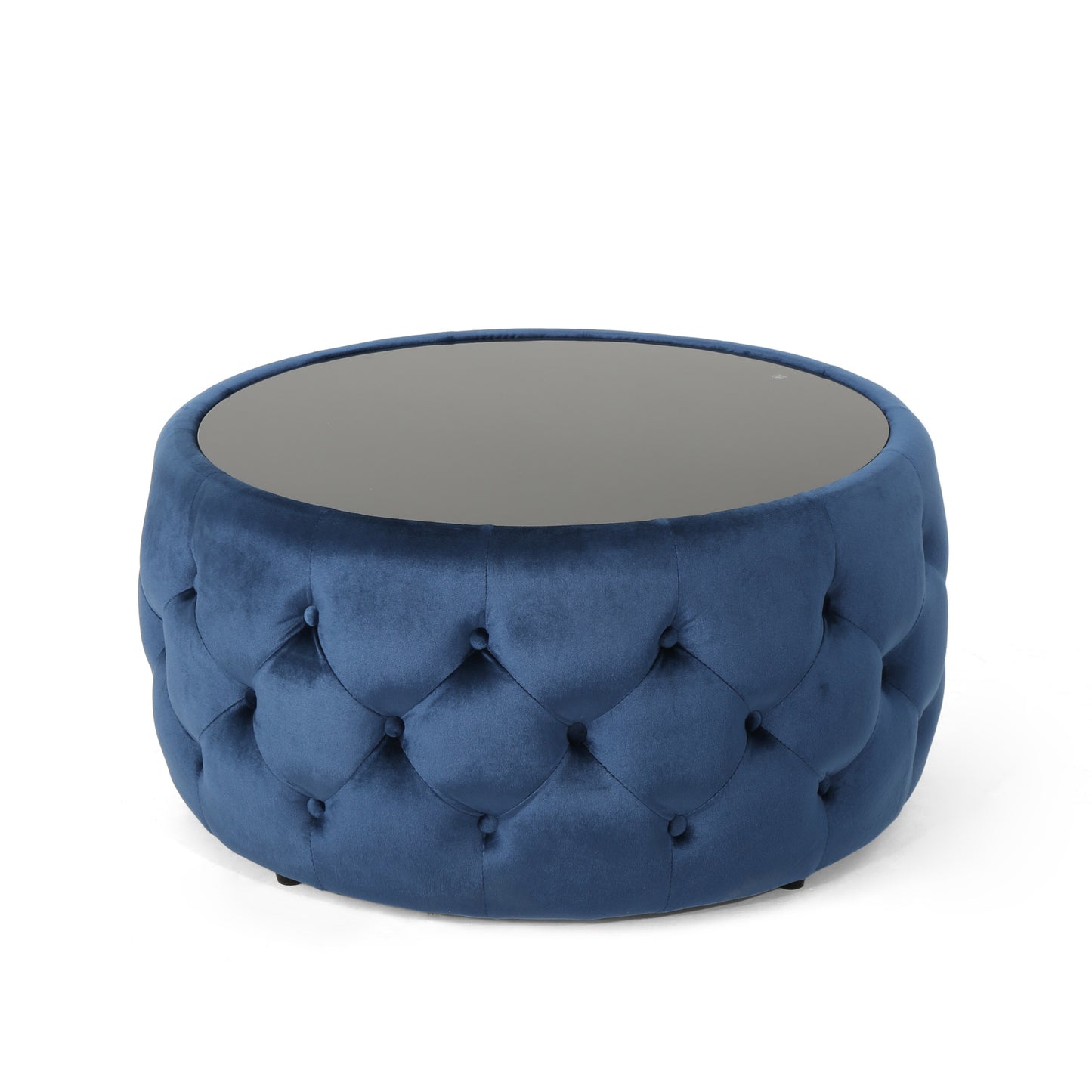 Round blue velvet ottoman with tufted detailing and a dark mirrored top
