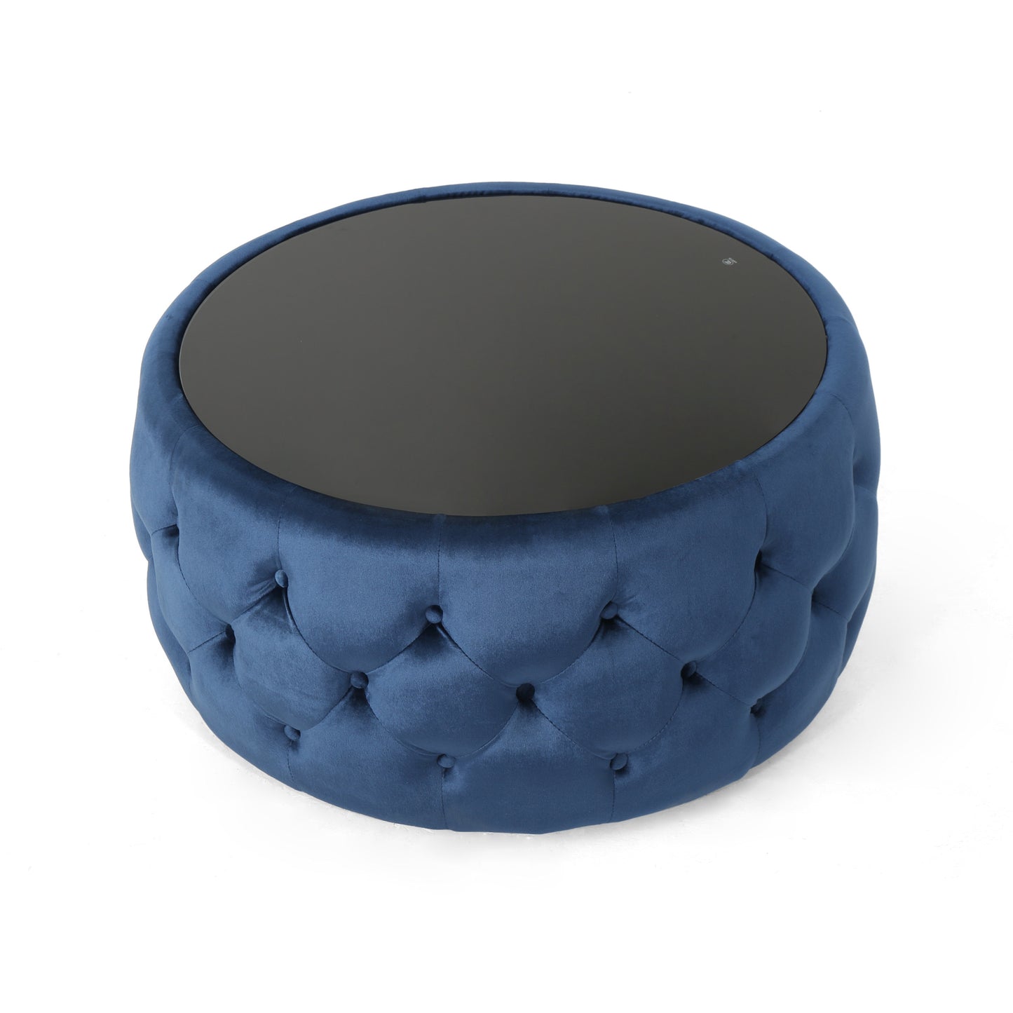 Round navy blue velvet ottoman with diamond tufting and a dark glass top