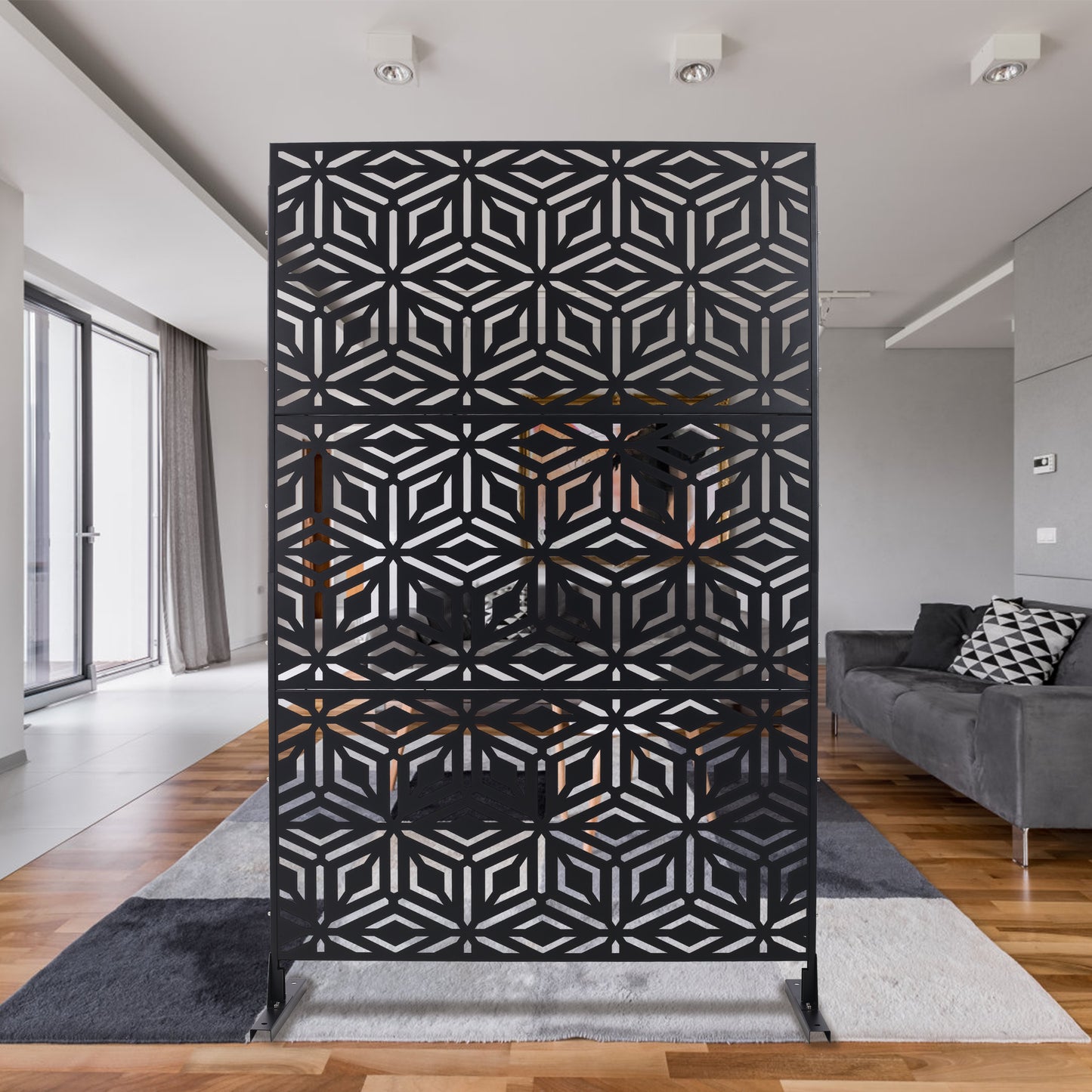 Black geometric room divider with lasercut pattern perfect for interior design