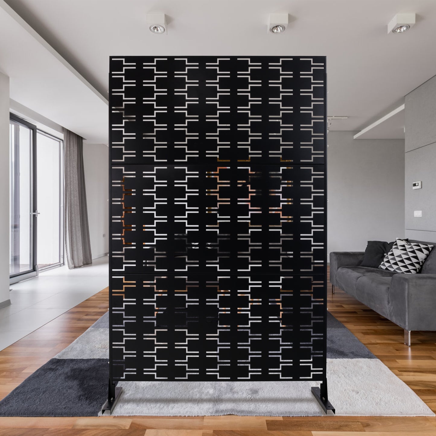 Modern black room divider with geometric cutout pattern perfect for living spaces