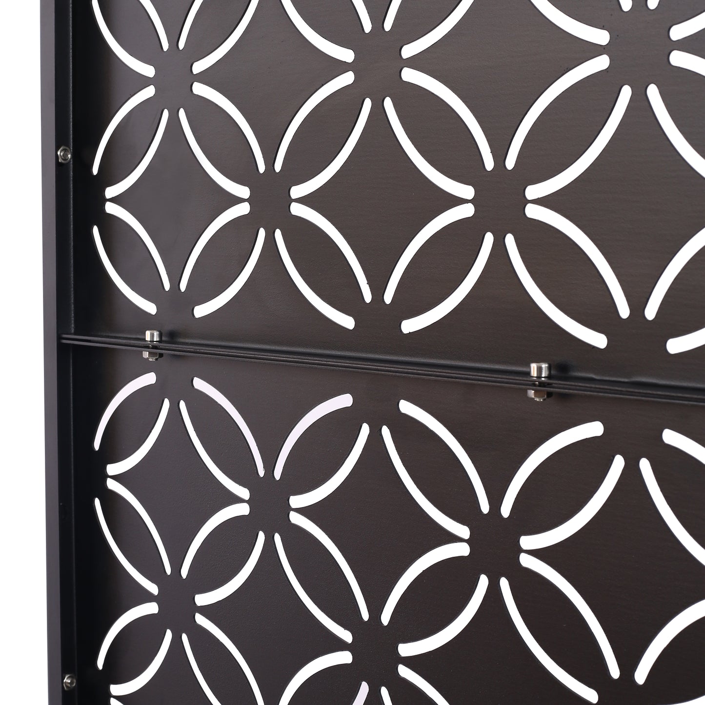 Dark brown metal decorative screen with a repeating quatrefoil pattern