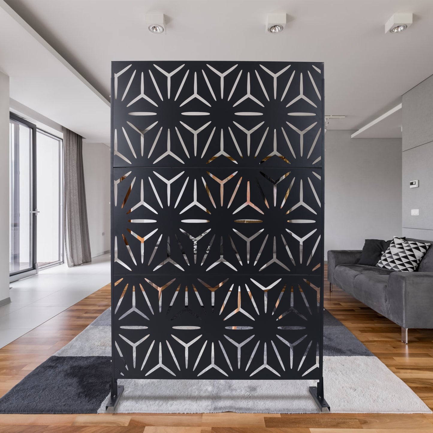 Modern black metal room divider with geometric cutouts for contemporary decor