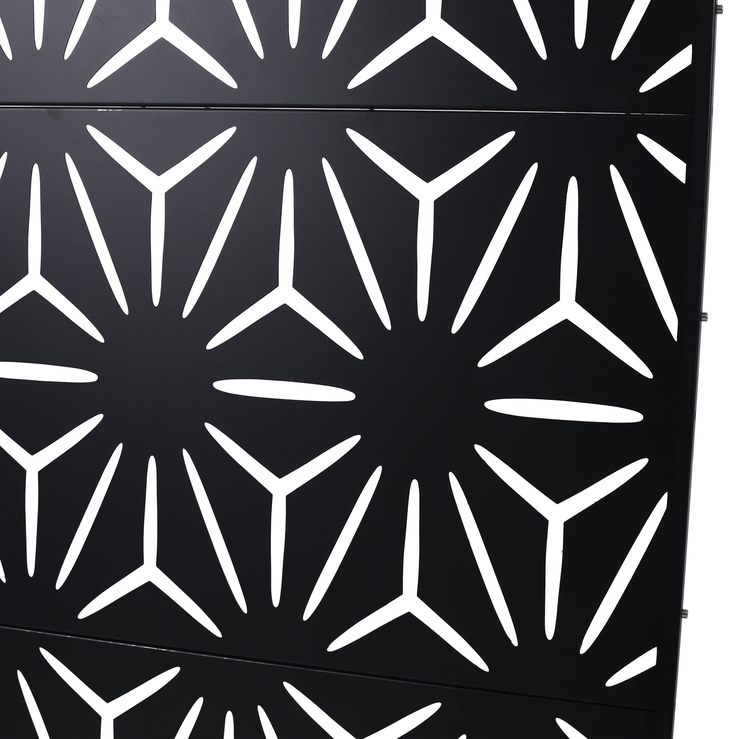 Black geometric metal screen with abstract starburst cutouts for outdoor privacy