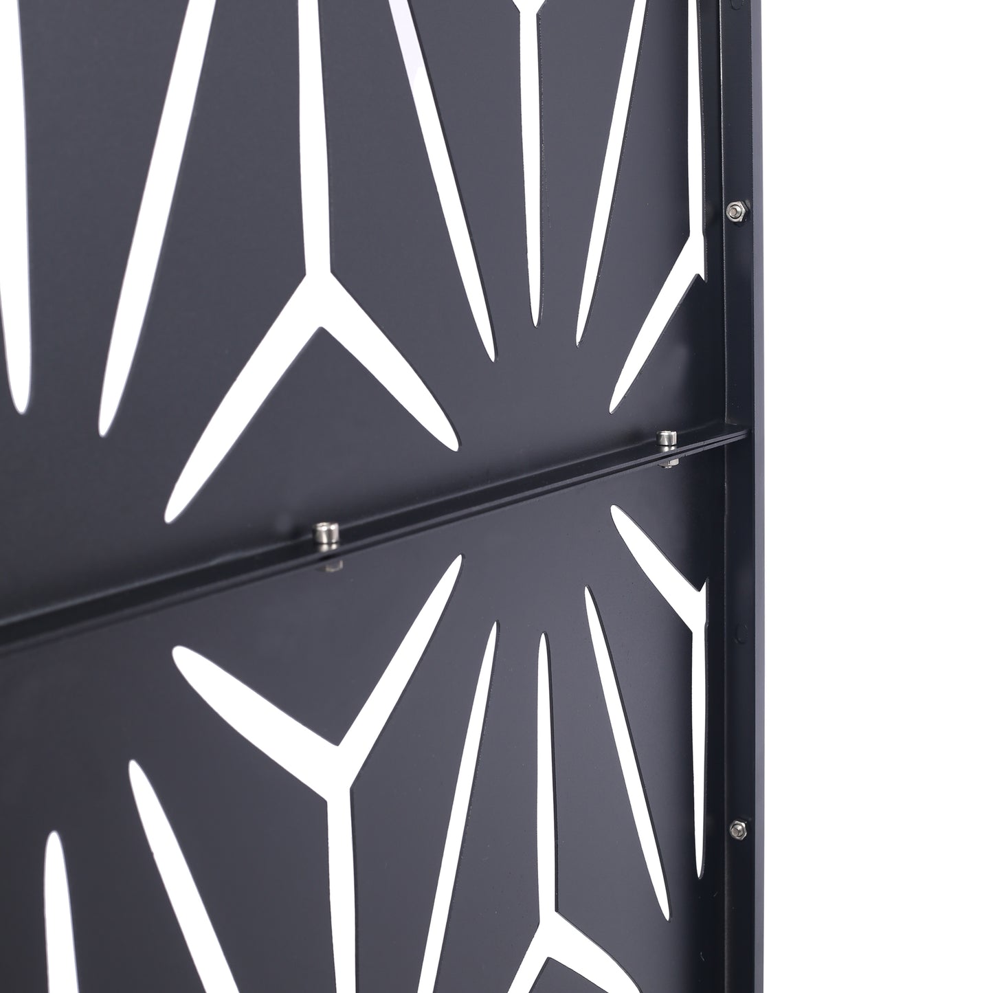 Black metal garden screen with abstract geometric cutouts and visible bolts