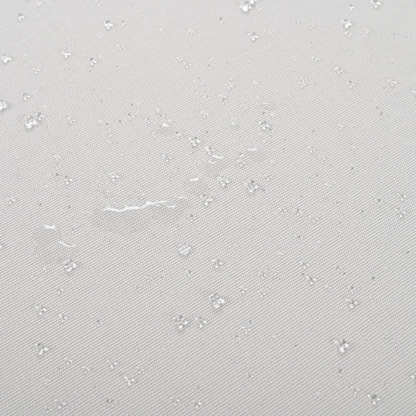 Light gray fabric with visible water beads demonstrating its waterproof quality