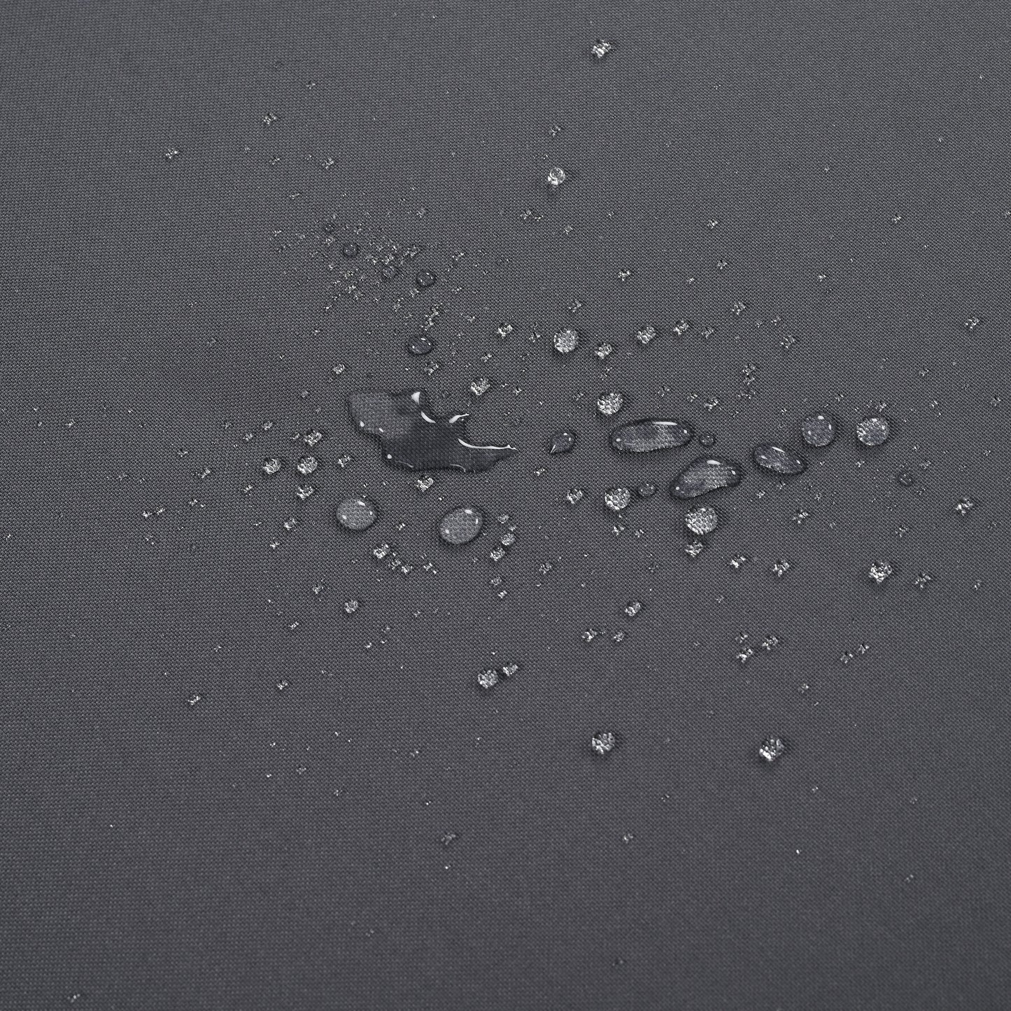 Closeup of water beads on dark grey waterproof fabric texture
