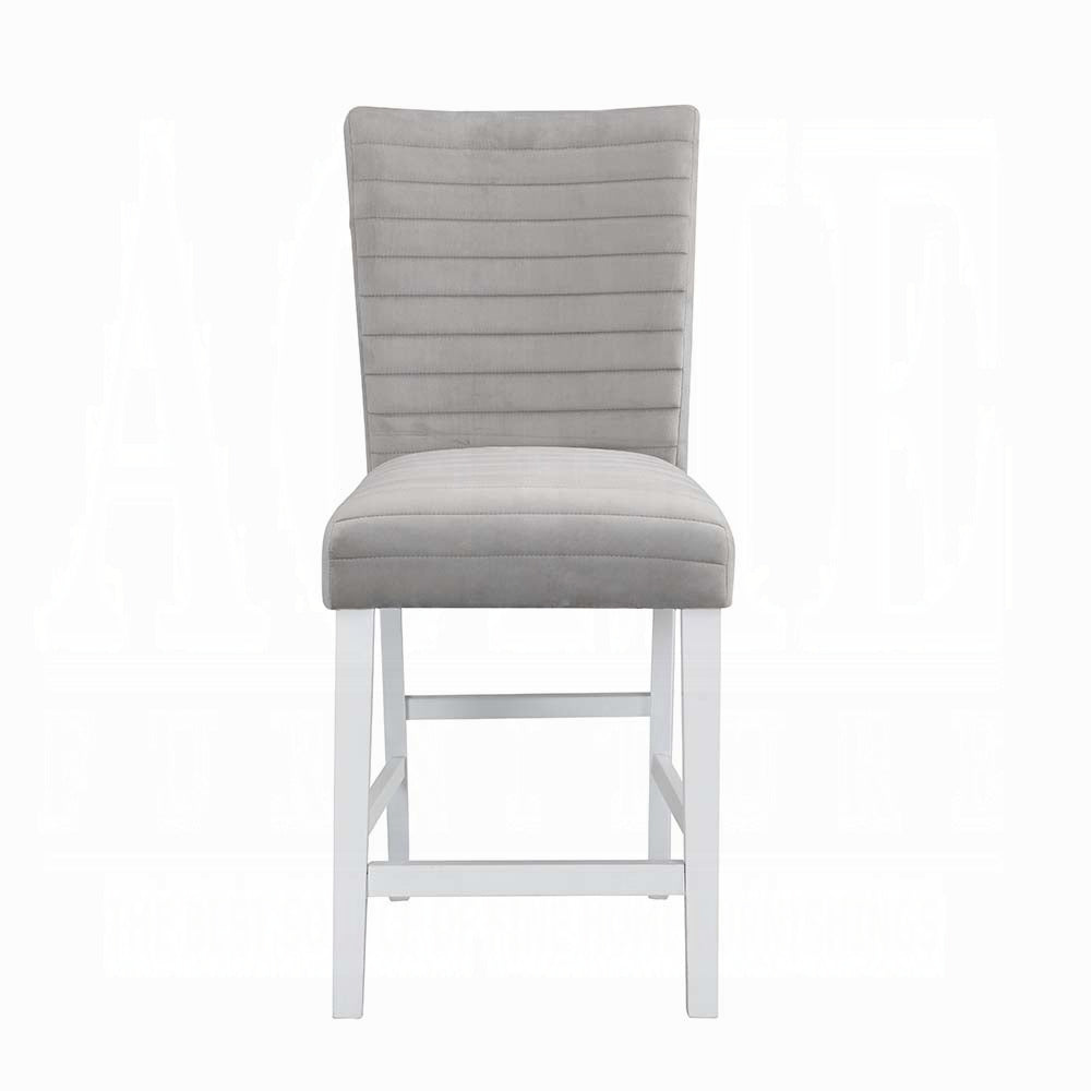 Grey velvet upholstered counter stool with horizontal tufting and white wooden legs