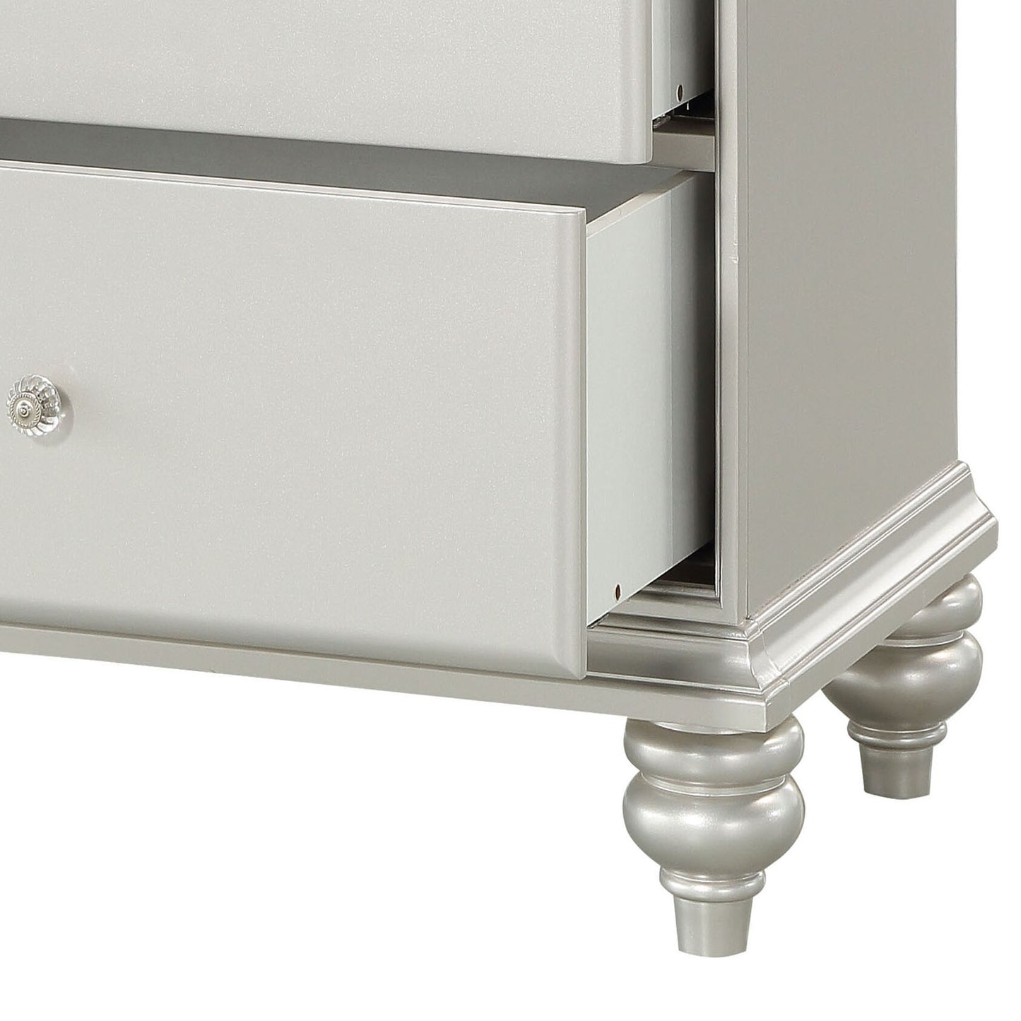 Silver dresser with crystal knob showcasing a classic furniture design