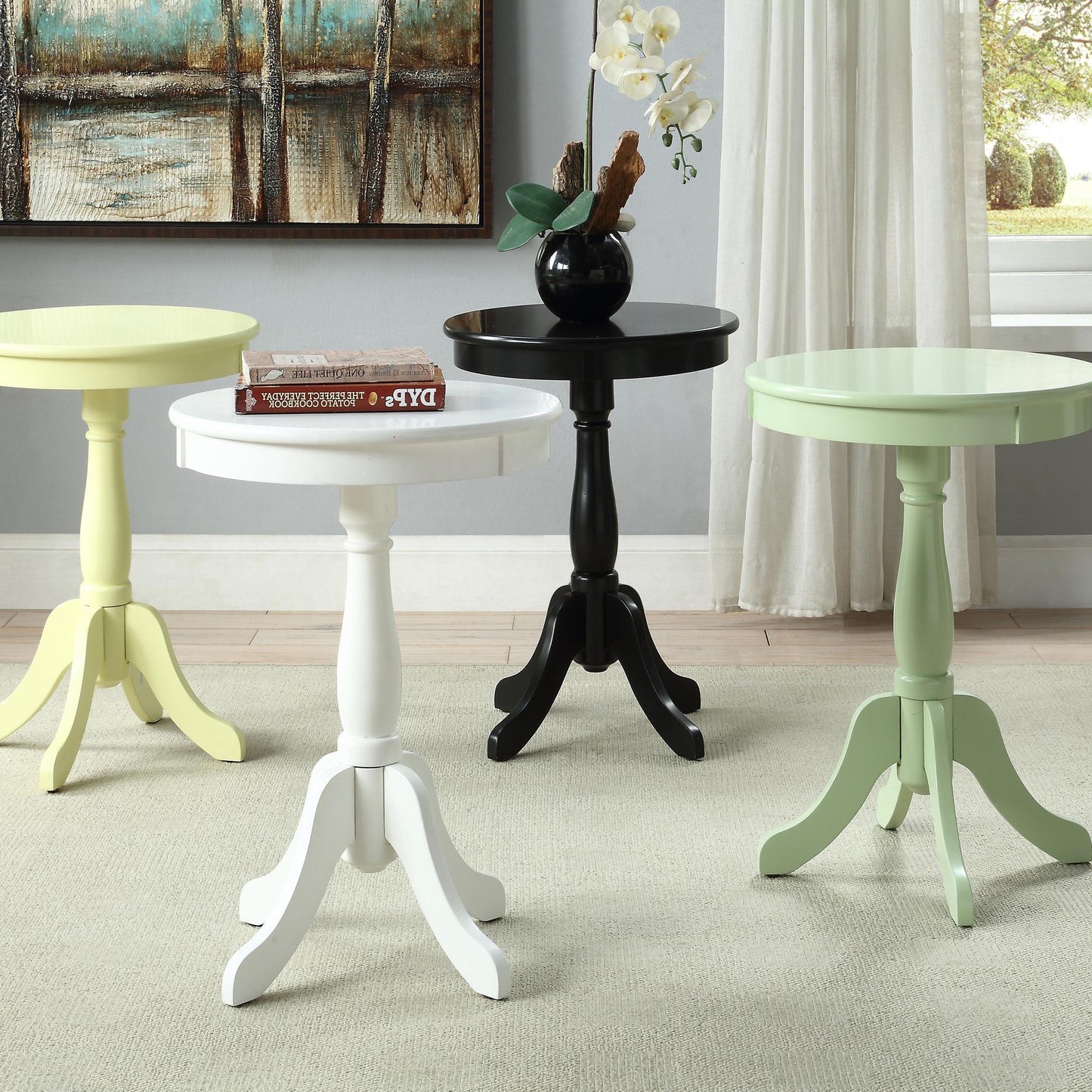 Pale yellow pedestal accent table ideal for small spaces