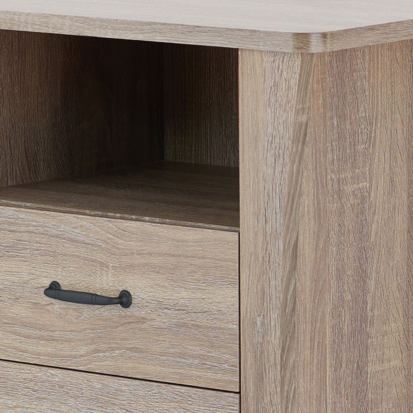 Light brown wood grain texture on a drawer with a black pull handle