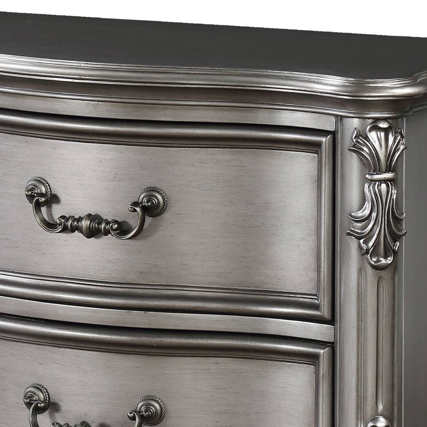 Elegant gray dresser with ornate drawer pulls and carved detailing perfect for a classic bedroom