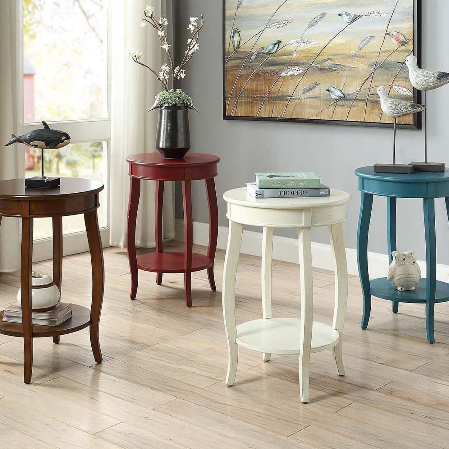 Round wooden end table with ornate carved legs and a dark wood finish