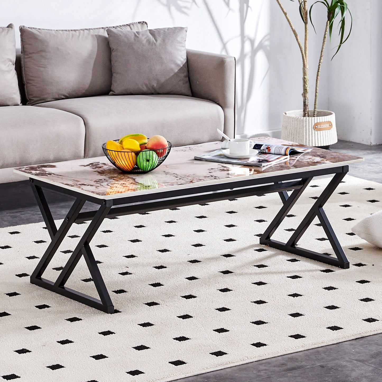 Glass top coffee table with marble pattern and black metal base perfect for modern living rooms