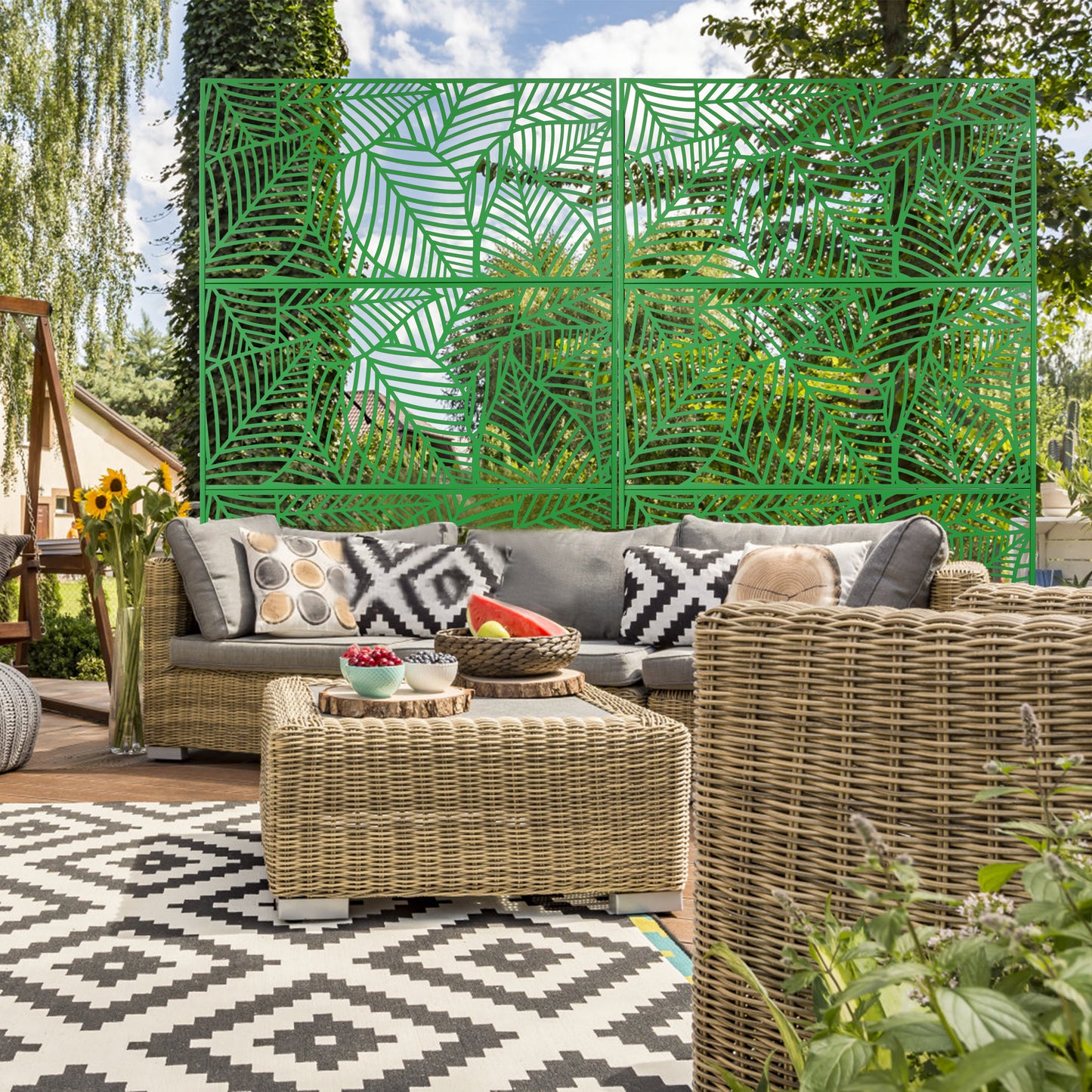 Green decorative garden screen with lasercut leaf pattern for outdoor privacy