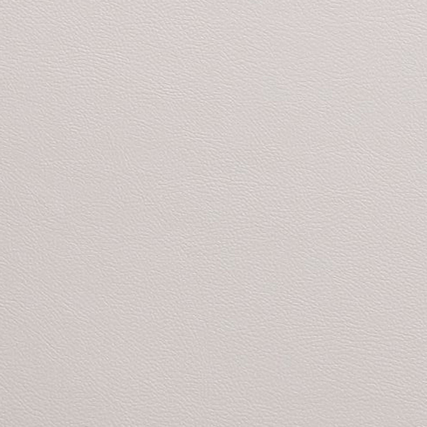 Closeup of textured light grey vegan leather fabric for upholstery
