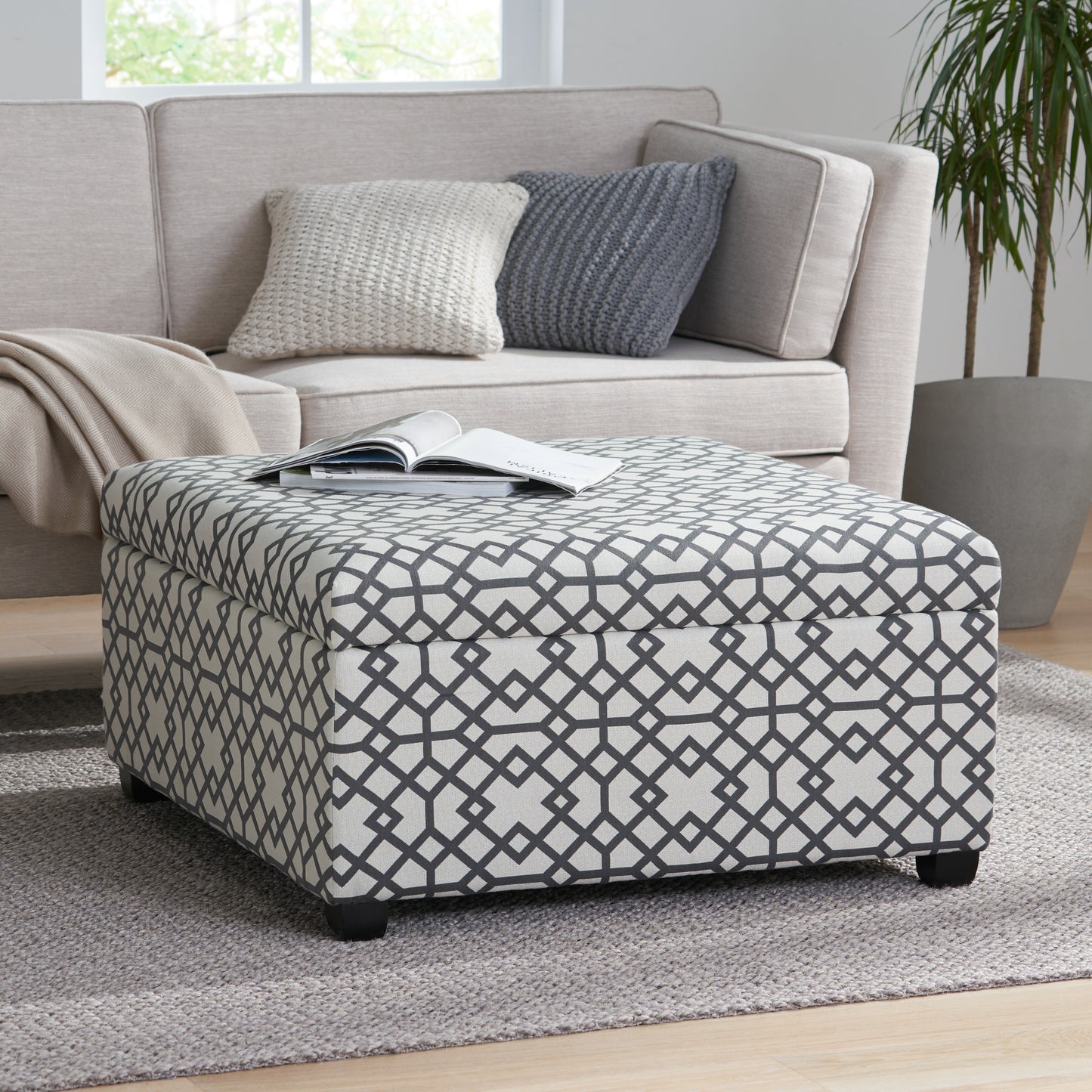 Geometric print storage ottoman with grey and white pattern