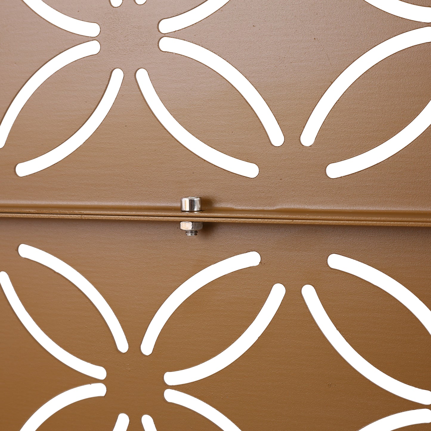 Brown metal garden planter with an ornate floral cutout design pattern