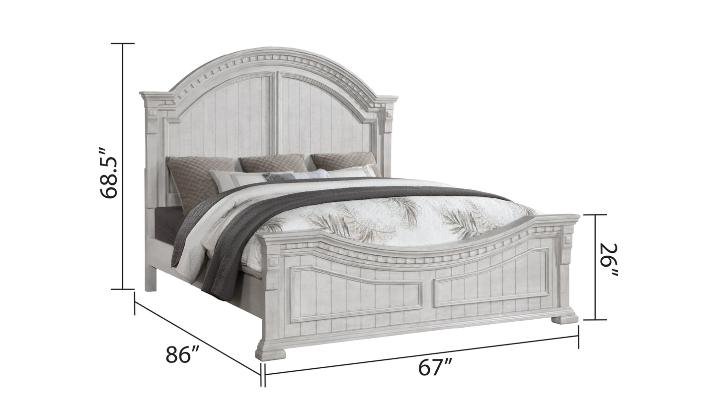 Distressed white wooden bed frame with carved details and arched headboard