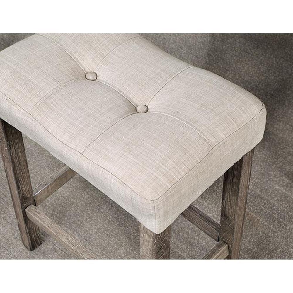 Tufted beige fabric counter stool with distressed wood legs ideal for kitchen islands