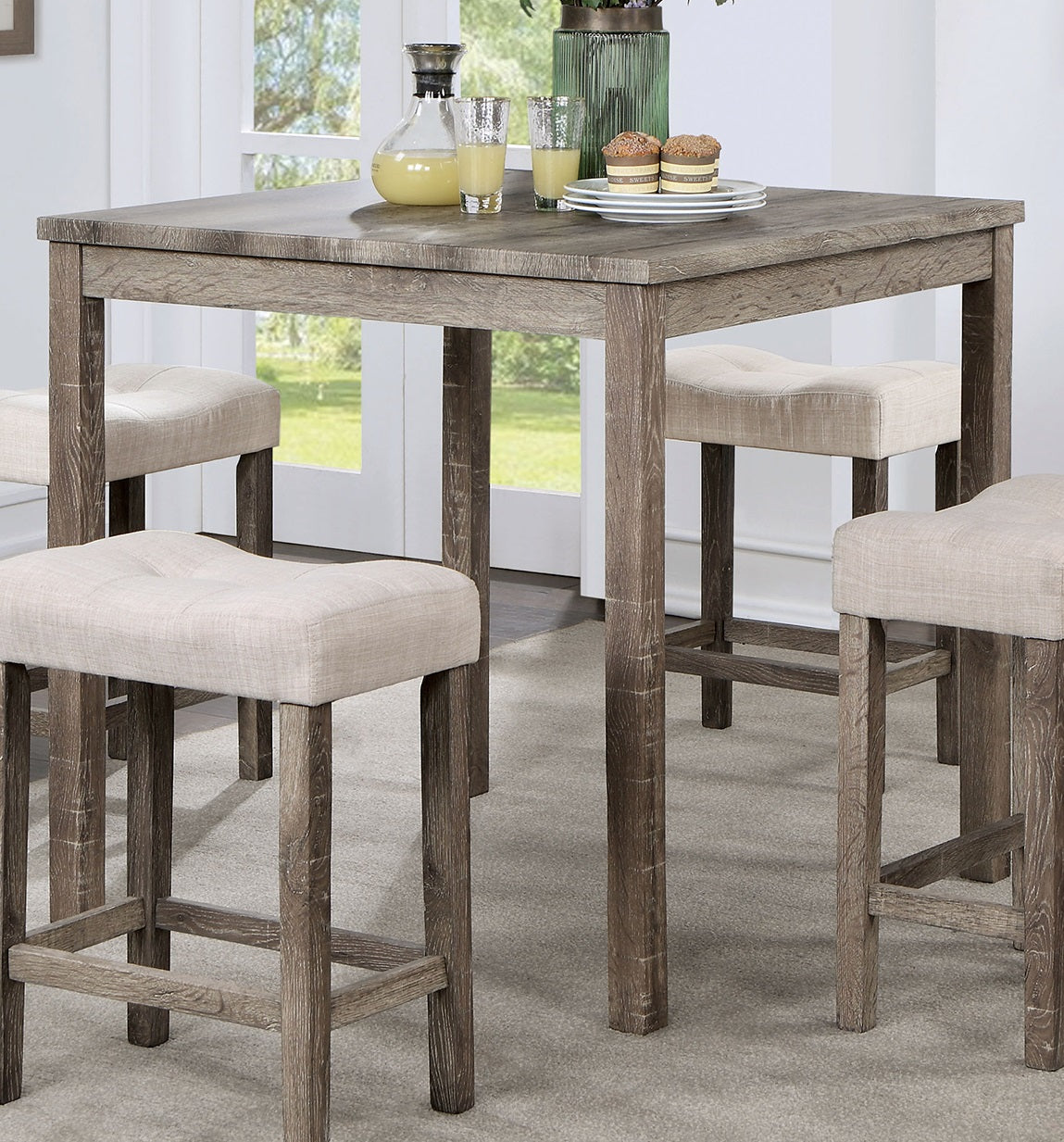 Rustic gray wood counter height table with four tufted beige stools
