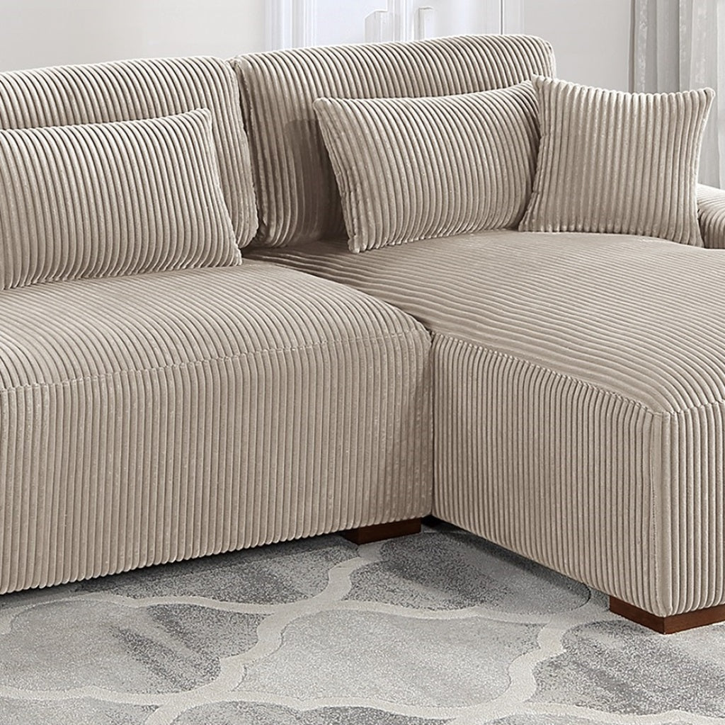 Sectional corduroy sofa in beige featuring plush cushions and modern design
