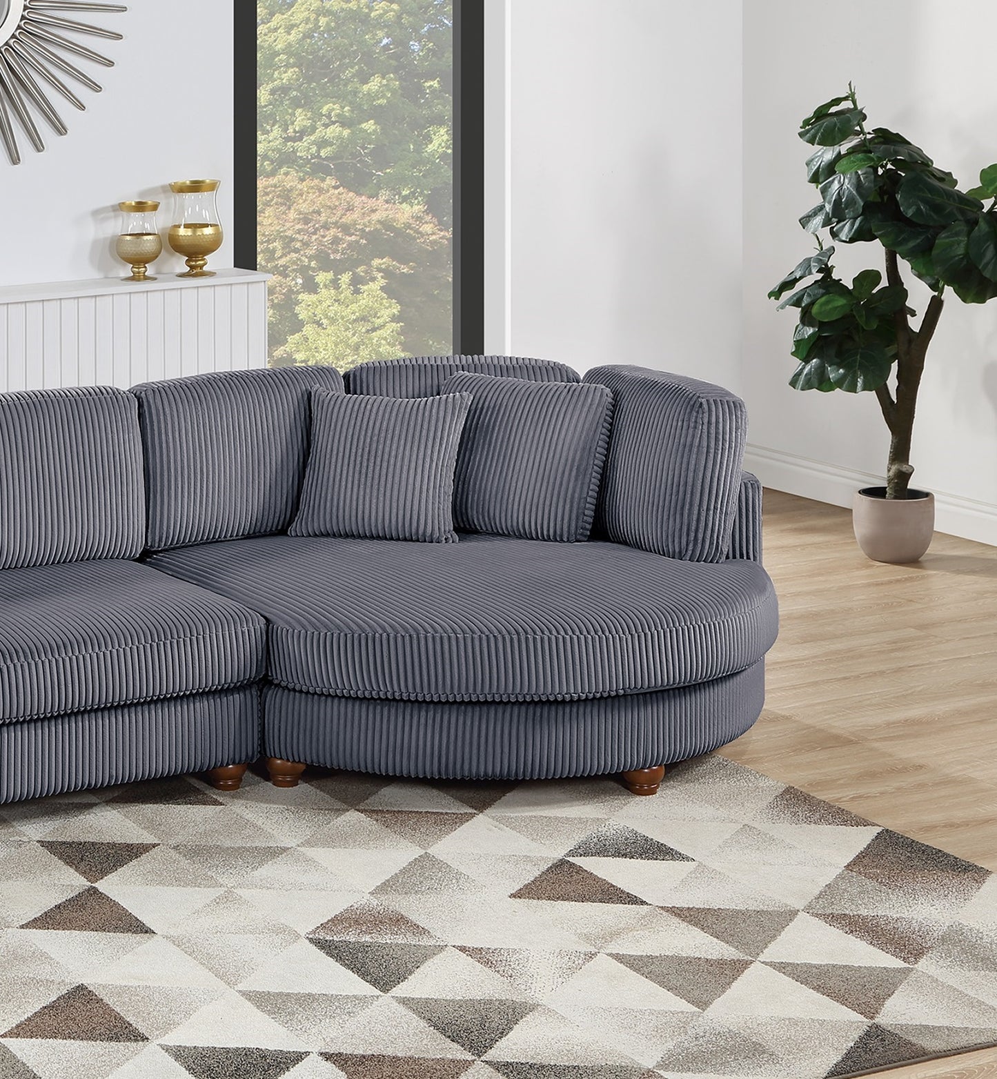 Plush grey corduroy sectional sofa with rounded arms and plush cushions