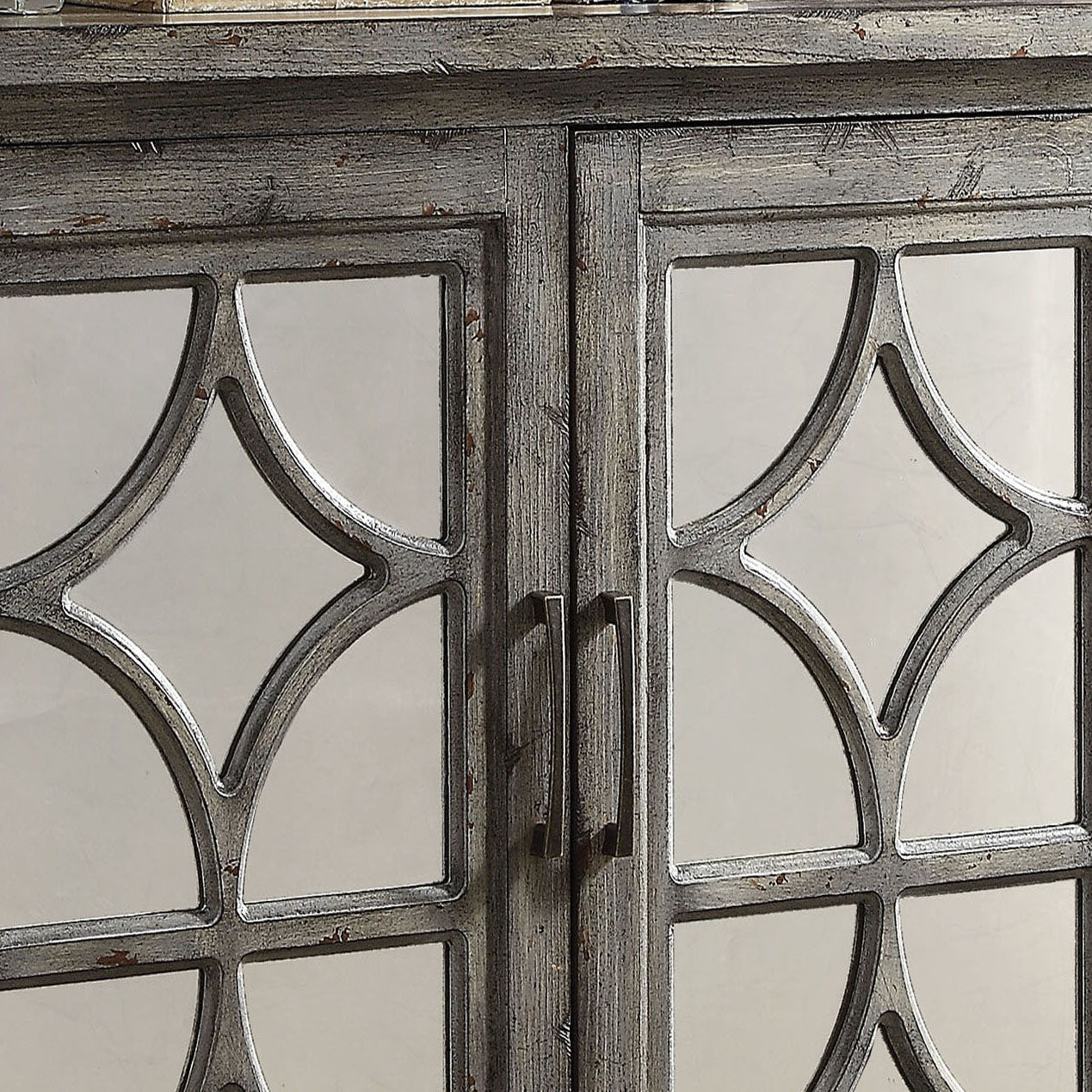 Antique grey cabinet with mirrored doors and decorative fretwork